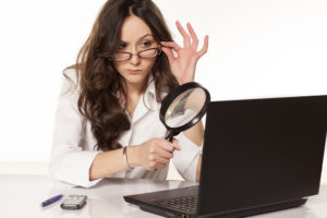 Woman uses a computer to locate someone